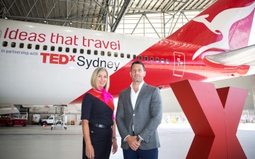 Assoc Prof Michael Biercuk and Qantas crew member